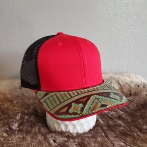 Ball cap with hand-sewn leather patch on brim